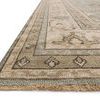 Close-up detail showing thick pile texture and fringe edge of the aqua and stone rug