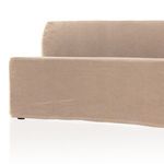 Front lower view of bench showing slipcover edge near floor and seat
