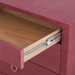 Partially open top drawer revealing metal glides and natural wood interior