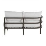 Right side profile of sectional sofa with plush white cushions and metal frame