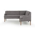 Side view highlighting curved armrest and supportive back cushions of gray banquette
