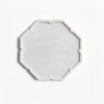 White marble tray with polished finish and lotus-inspired octagonal shape with soft scalloped edges