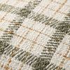 Close-up showing detailed woven texture of plaid pattern and fabric fibers on pillow front