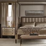 Close-up side view of Clarendon canopy bed headboard and brass-accented nightstand with lamp