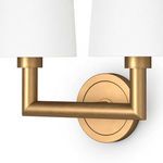 Side view focusing on brass arm and circular wall mount details