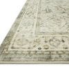 Close-up angled view showing plush texture and detailed border pattern with sage and beige hues