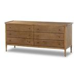 Close-up showing natural wood texture on drawer front with round wooden knob