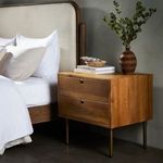 Close-up detail of darker oak wood grain on side panel of stained nightstand