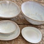 Close-up overhead view showing organic shape and blue-white glaze pattern inside multiple bowls