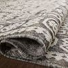 Folded edge highlighting the flexible, power-loomed polypropylene weave and backing