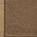 Close-up of the Kai Pebble Rug on light wood flooring showing edge detail and color depth