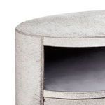 Close-up of top open shelf area showing dark inner lining and light faux fur upholstery edge