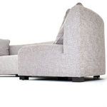 Detail of two cushions angled against the armrest with visible seam stitching