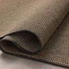 Rolled-up section of Providence rug showing texture and flexible polyester material