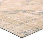 Close-up angled view showing textured jute weave and distressed medallion pattern in slate blue and tan