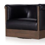Close angled view of chair base showing rich ash veneer wood framing with natural grain