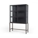 Three-quarter angle of Spencer Curio Cabinet with closed doors on iron pedestal base