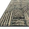 Close-up angled view showing the rug's textured surface and clean black edge binding