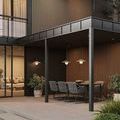 Evening outdoor setting with illuminated sconces on dark textured wall by modern patio
