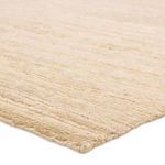 Close-up angled view showing textured weave and thickness of the Kazbek tan striped rug