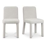 Place dining chair pair shown in slight angle highlighting rounded legs and plush seat depth