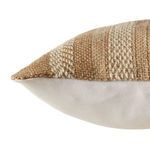 Close-up of pillow's corner showing woven beige stripes on front and smooth ivory fabric on back