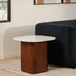 Dash accent table used as bedside table in minimal bedroom with black metal bed frame