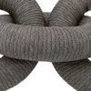 Close-up top view focused on the intersection of the three rope-wrapped links