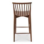Back view focused on vertical spindles and elegant tapering of walnut legs