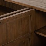 Detail view of cabinet door frame construction with visible wood dowels and joinery.