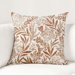 Pillow displayed on white couch showcasing overall design in room context