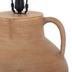 Close-up of terracotta base top with curved handle and black lamp socket