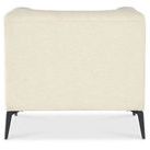 Back view of Nicolla Chair showcasing smooth Baldwin Natural fabric and black tapered metal legs