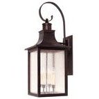 Monte Grande Wall Mount Lantern in English Bronze with pale cream seedy glass and a curved top arm