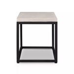 End view of bench displaying square stone top and black metal frame in geometric box shape