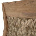 Close-up of teak armrest and edge of white fabric cushion