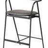 Gianni Counter Stool with a thin matte black metal frame and curved backrest, featuring a dark gray seat cushion