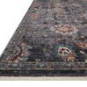 Angled low view of Samra rug edge highlighting thickness, soft pile texture, and finished fringe