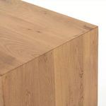 Close-up of top corner showing smooth oak finish and wood details