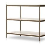 Close-up of marble shelf corner supported by cylindrical antique brass iron post