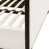 Detailed view of slat mounting and bed frame joint under upholstered fabric