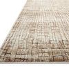 Low angle side view showing the rug's textured pile and thickness on white background