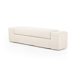 Three-quarter front angle showing smooth slipcover fit over thick cushion and wide arm