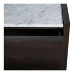 Close-up of marble top edge and upper drawer front with dark wood texture and clean lines