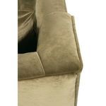 Close-up of plush padded armrest corner highlighting velvet texture and piping detail