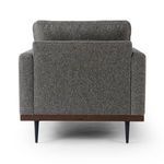 Rear view emphasizing the smooth, unadorned back panel and almond wood base