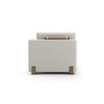 Back view highlighting clean-lined silhouette and leather wrap detail across the chaise backrest