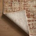 Corner of Heritage Brick Multi Rug lifted to reveal tightly woven backing and edge binding