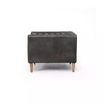 Rear view of ebony leather chair showing smooth back panel and wooden legs