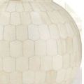 Close-up of the Osa Drinks Table base showing hexagonal bone tile pattern with subtle color variations